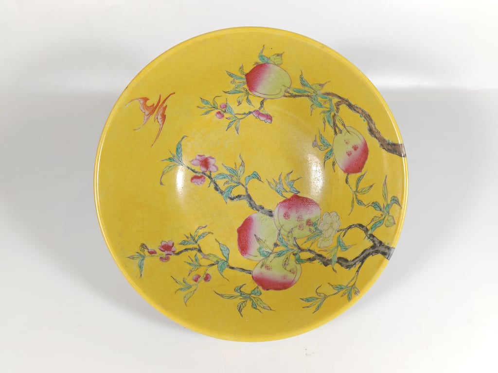 A Large Yellow Ground Bowl featuring Peaches and Bats