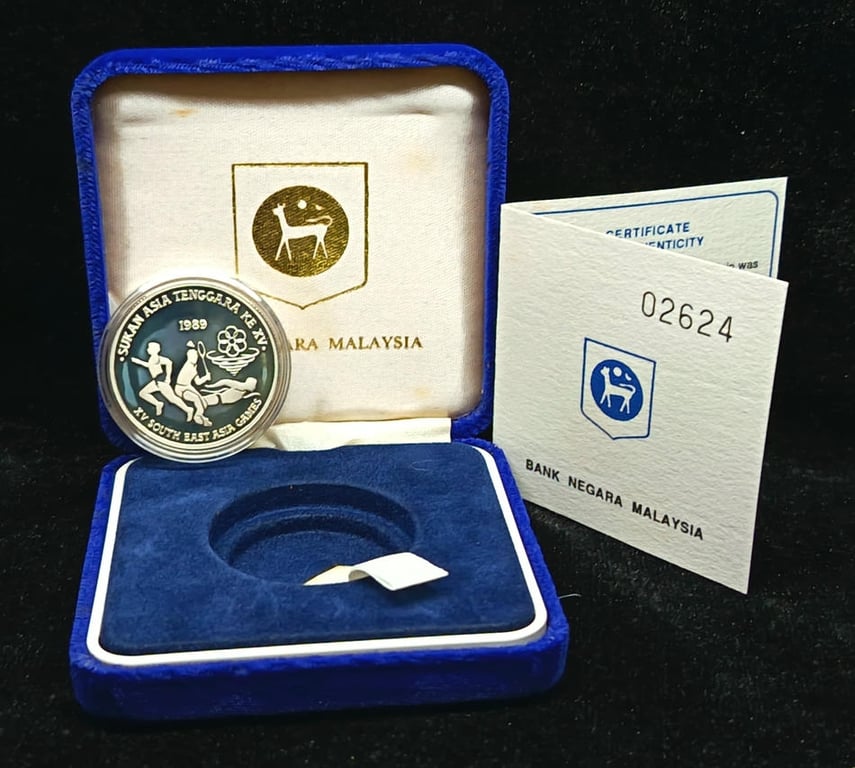 KM#48. Malaysia. 15 Ringgit. 1989. Southeast Asian Games. Kuala Lumpur. Silver 0.925 - 16.73g. Proof Coin. Oxidation. with box light foxing
