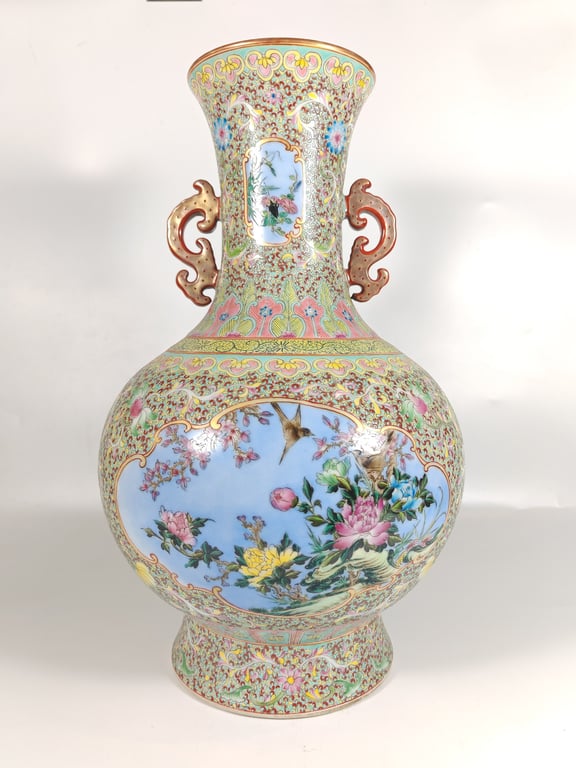 A Large Chinese Famille Rose Porcelain Vase featuring Bird and Flower Motifs on Turquoise Ground