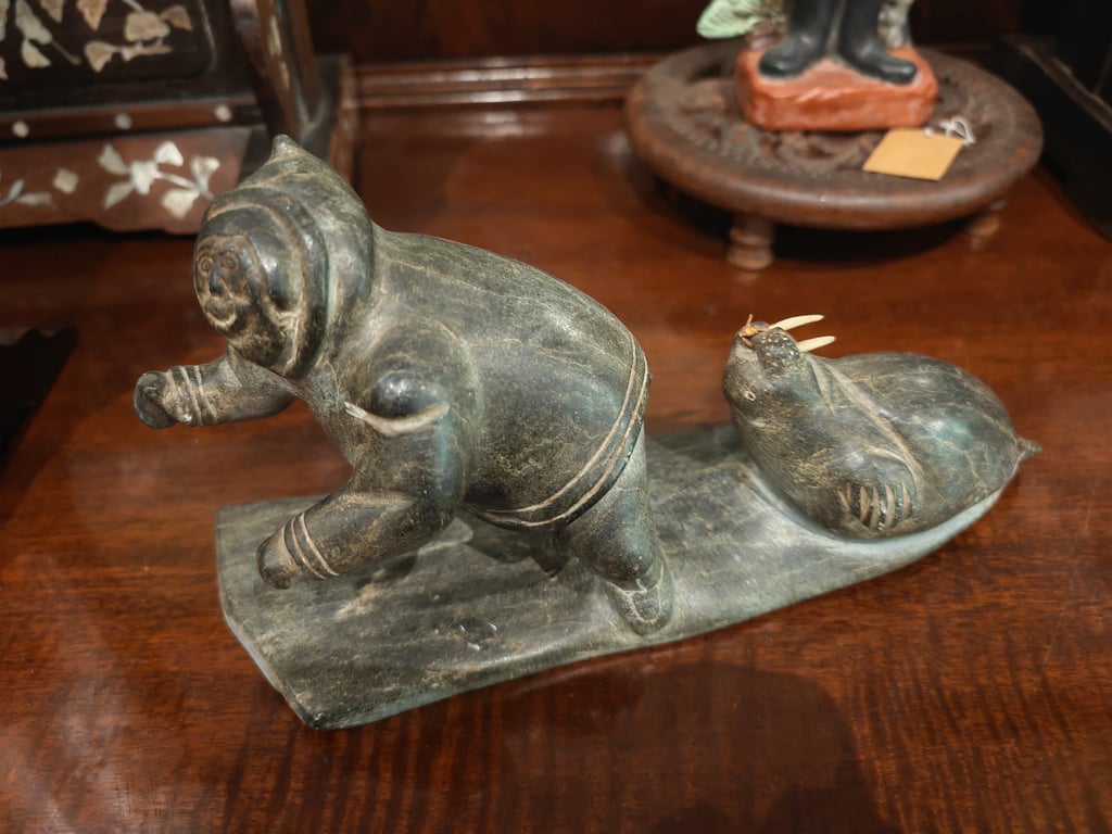 Sculpture of Inuit Hunter with a Walrus 