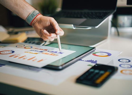 photo of a man reviewing business charts