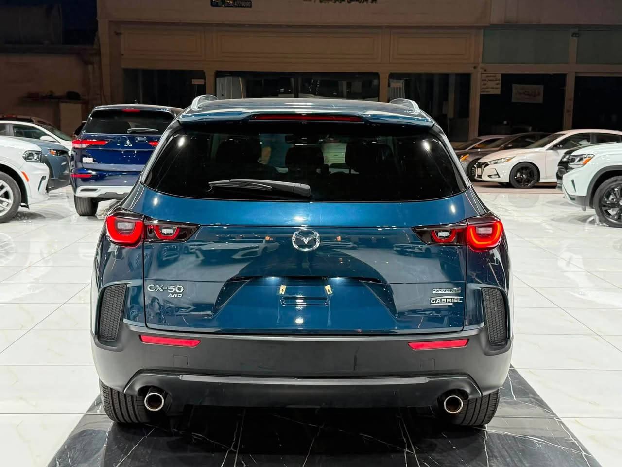 ‎مازدا Cx50 2024 فورويل AWD
‎حجم المحرك 4 سلندر 2500cc تنفس طبيعي 
‎عدد المقاعد 5 راكب
‎السیارة ماشي 8 الف
‎حادث نص جملغ الخلفي  السائق 

‎مواصفات فول
‎- بصمة
‎- دخول ذكي بدون مفتاح
‎- دبل اكسل
‎- بانوراما
‎- مود درايڤ ايكو وعادي وسبورت
‎- رادار امامي خلفي
‎- تحديد مسار
‎- نقطة عمياء
‎- كشنات جلد
‎- شاشة
‎- ⁠كاربلي CarPlay 
‎- كامرة خلفية
‎- تبريد مركزي قطعتين
‎- صندوق خلفي كهرباء
‎- سايد بريك لمس
‎- اوتو هولد
‎- لايت امامي ليد
‎- هيتر -تبريد كشنات امامية
‎- هيتر ستيرن 
‎- اشاير مري
‎- تخم تاير جديد 
‎- تخم دسكات جديد 
‎وبقية المواصفات موضحة بالصور ‎
‎مکان سیارة اربیل السیارە رقم کاتي تترقم شمالي
‎للاتصال والاستفسار
‎☎️کورك ***********
‎‏‎☎️اسیاسیل ***********
