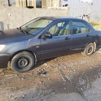 مستەربۆشی لانسەر مۆدیل ٢٠١٠ ڕەنگی نەوتی... مەکینە بچوک گێڕو مەکینە بەش...