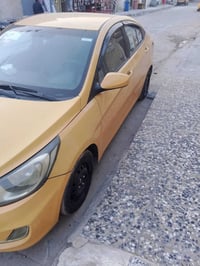للبيع اكسنت موديل 15 للبيع الون اصفر تكسي  محرك 1600 رقم السياره بغداد...