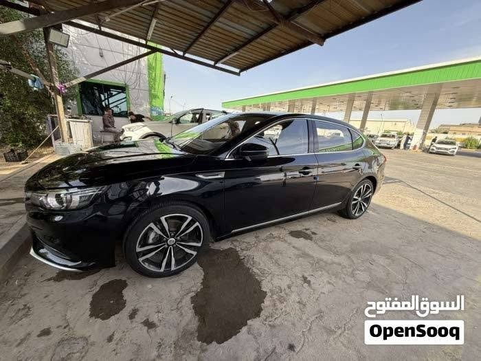 MG 6 THROGHY 
MG6 الفول مواصفات
مرقم بصره بأسمي رقم دولي 
عداد المسافة 32 الف كيلو
محرك 1.5 تيربو
ناقل سرعة دبل كلتش 7 سرعات
قوة المحرك 169 حصان
عزم الدوران 250 نيوتن / متر
مصابيح نهارية LED
مصابيح خلفية LED
مرايا كهربائية
اشارات في المرايا الكهربائية
مرايا قابلة للطي بشكل الكتروني
مقود جلد
مكابح توقف الكترونية EPB
مكابح انتظار الكترونية Auto Hold
نظام الثبات الالكتروني ESP
نظام توزيع قوة الكبح EPD
نظام مكابح المنعطفات CBC
نظام مراقبة ضغط الهواء في الاطارات
تكييف الكتروني ثنائي المنطقة
نوفذ كهربائية مع فتخ واغلاق اوتوماتيكي
مثبت سرعة
ناقل سرعة في المقود ( بادل شيفتر )
بصمة
مسند يد خلفي مع حامل اكواب
مقود قابل للتعديل
شاشة 8 انش مع كاميرا
بلوتوث
مداخل USP مع شاحن
مداخل كهرباء 12 فولت
Android Auto
Apple Car Play
تحكم بالمقود
حساس خلفي
شاشة عدادات 3.5 انش
عادم مزدوج ) دبل اكزوزت ( فتحة سقف
دوسات بنزين وبريك معدنية رياضية
جنط 18 المنيوم
اطارات بروجستون
مقاعد جلد
مقعد سائق كهربائي ب 6 حركات
6 وسائد هوائية
نوفذ كهربائية مع فتح واغلاق اوتوماتيكي لجميع
النوافذ
نظام الاضاءة التلقائية
اغلاق النوافذ تلقائيا عن قفل السيارة

ضمان 6 سنوات او 200,000km ايهما اقرب

التواصل على الرقم ***********

نص مكتوب في الصور:
- السوق المفتوح OpenSooq