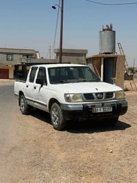 نيسان بك اب • ١٩٩٨ • دشبول احمر