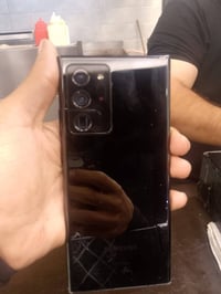 الجهاز الي بالصورة هو Samsung Galaxy Note 20 Ultra 5G ذاكره 128 بي شخط...