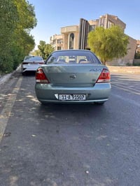نيسان كوري بيه اي نقص كير محرك مكفول بيه 2صبغ مكان سياره الاعظمية  جمل...