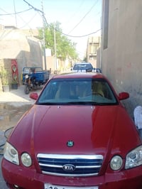 وبركاتة  كيا اوبتما موديل 2004 محرك 2700  رقم بابل دولي بأسمي كير محرك...