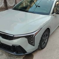 كيا K4 لون سمنتي موديل 2025 ماشية 46 الف السيارة كلش جديدة   رقم بغداد...