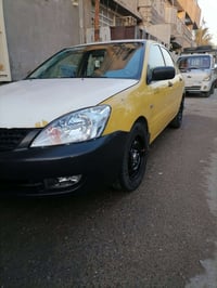 لانسر • 2010 • باسمي بغداد