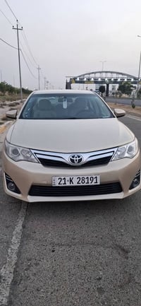 كامري ٢٠١٢ امريكي لون ذهبي ماشية ١٨٨ ميل غاز وبنزين بدون صبغ بيه نص جا...