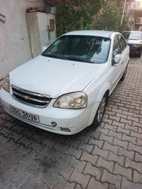 اوبترا 2012 بيها صبغ 5قطع رقم بغداد انكليزي بسمي لسياره شرق لتحويل مكا...