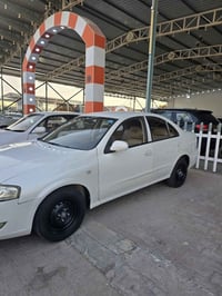 وبركاتة من رخصة الادمن  للبيع  نيسان صني  اللون ابيض  رقم بابل انكليزي...