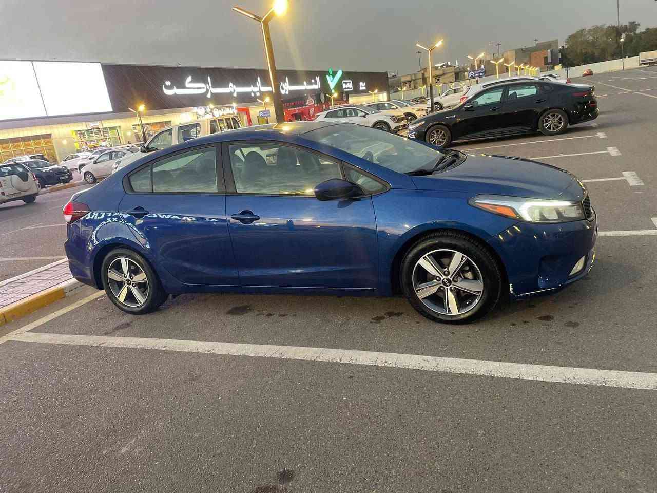 كيا فورتي (Kia Forte) موديل 2018 - للبيع
​للبيع سيارة كيا فورتي موديل 2018  لون جويتي مميز، السيارة بحالة ممتازة وجاهزة للاستخدام بدون أي مصاريف إضافية.
ماشيه 70 الف ميل
​مواصفات ومميزات السيارة:
ثلاث انظمه قياده ايكو،نورمل،سبورت.مثبت سرعه 
​الموديل والمحرك: موديل 2018، محرك 2.0L دوش نشط واقتصادي جداً بالبنزين. كير at المرغوب
​المواصفات: مواصفات كندية، شاشة لمس  مع تحكم كامل جهتين بالستيرن، تدفئه كشنات، كشافات أماميّة، وحاجب لد 
​الداخلية: دواخل السيارة نظيفة جداً بحالة الشركة، تدفئة وتبريد ثلج🥶
​الرقم: رقم بغداد مميز حلو بأسمي التحويل ثاني يوم 
​مكان المعاينة: بغداد الكرخ (الري)
​للتواصل والاستفسار: الاتصال على الرقم (***********) واتساب
