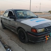 مازدا 323 • موديل ١٩٩٠ • بنزين كارباي