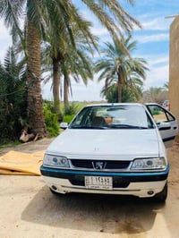 بيجو 405 • عسلي • رقم كربلاء