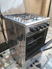 طباخ جديد  +  ستاند عدد 2 للبيع 07750319277