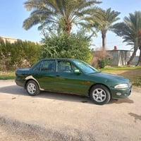 بروتون ويرا موديل 2002 رقم بابل انكليزي بأسمي كير ومحرك مكفول لا تنقيص...