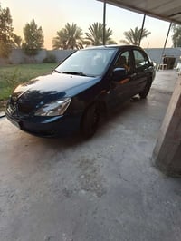 لانسر مكفولة كير ومكينة وحاديه مكاني بغداد السعر 60 وبيهة مجال 0787075...