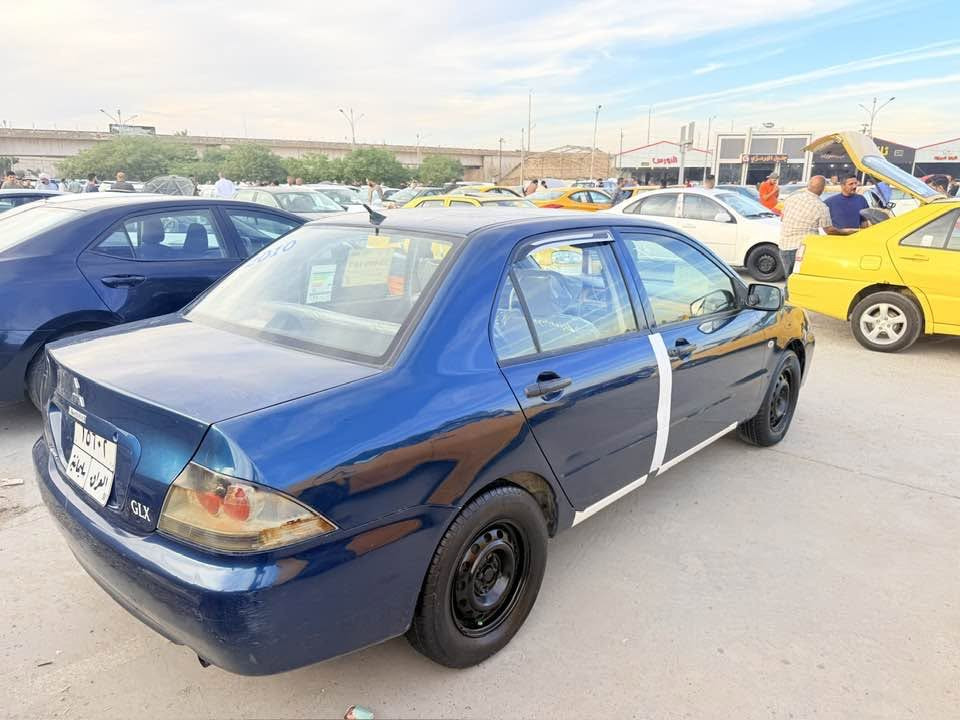 لانسر • ٢٠١٠ • ضرر باب سايق