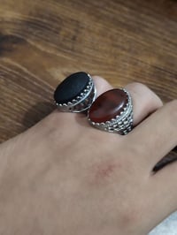 زوج محابس • عقيق طبيعي • صياغة نحاس