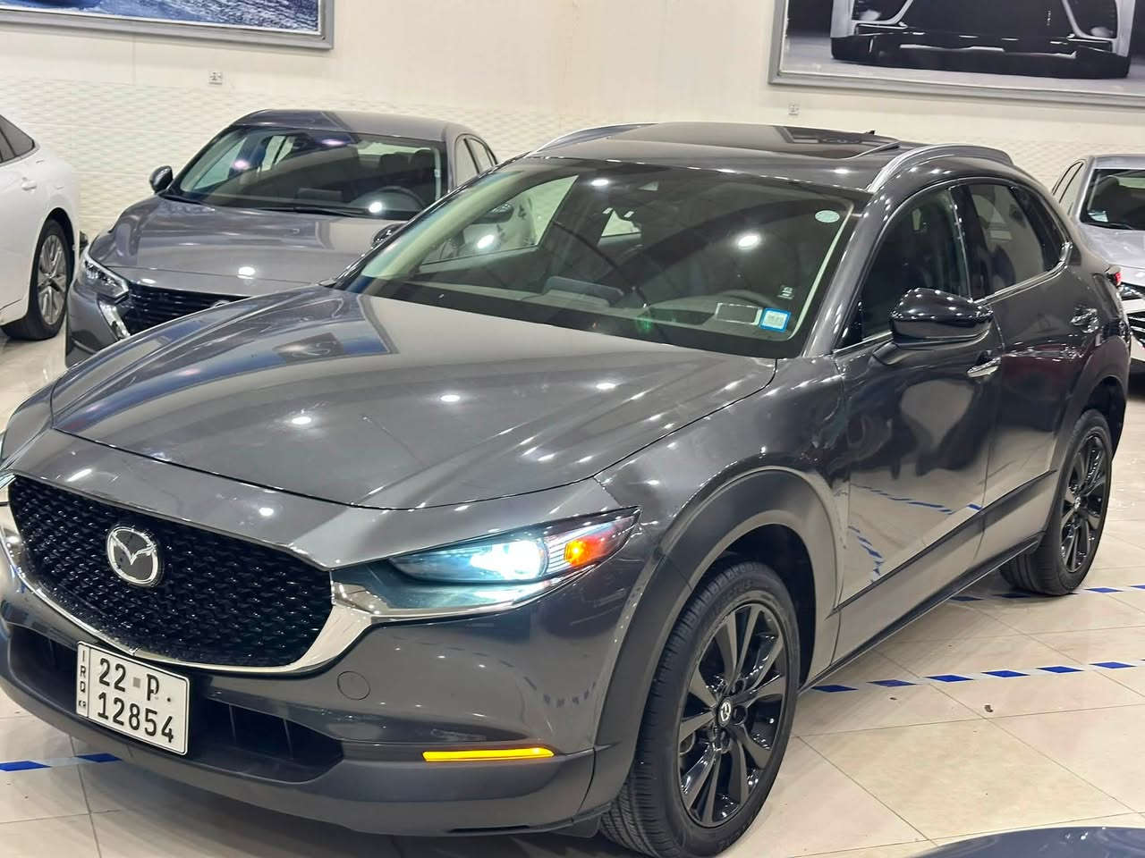 Mazda CX.30
Model 2023
موسفات premium plus 
داتاشؤ+ سلاد+AWD+كوشن كاره با +كوشن غزن + 
كوشن هيته ر + سوكان هيته ر + سندوق كاره با 
سماعه boss+ 
مه كينه 2.5 torbo 
بونت بيلاد گؤراوه 
چاملغ توزه ك pdr
 بي ناو گرتن بي ارباك
Ml 27000
نرخي 16000$ كه ميك محامه له 
بؤزانياري زياتر په يوه ندي بكه 
***********
