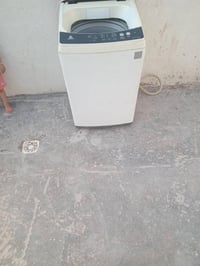 غساله شغاله كامله غسل وتجفيف بس الباب مفطور كامله من كلشي بغداد البياع...