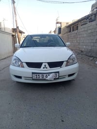 لانسر ٢٠١١ • مكينة ٢٠٠٠ • باسمي بغداد