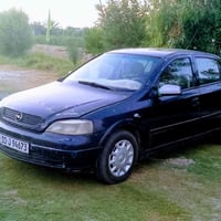 لبيع أوبل أسترا ماركه الماني موديل 2002 رقم بغداد أنكليزي سنويه 29 مكي...