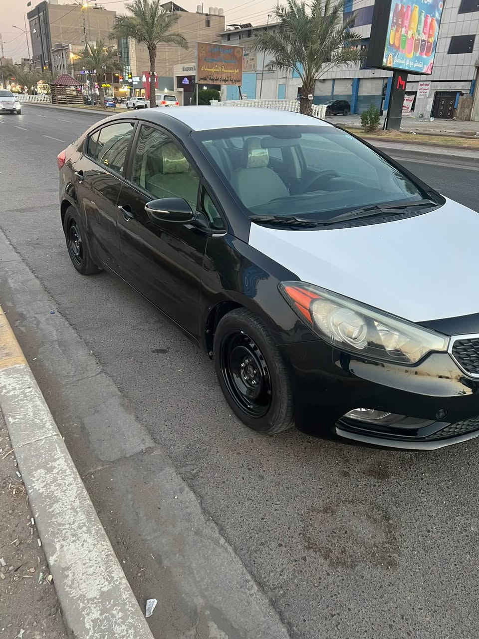 سلام عليكم كيا فورتي موديل 15 سياره نص فول تحكمات ستيرن شاشه جبيره ربط كار بلي محرك 1800 دوش كير ايتي تخم تاير جديد صدر حلو نضيف
رقم بغداد انكليزي سعر (90) وبيه مجال 
*********** مكاني بغداد الشعب

نص مكتوب في الصور:
- كار تشيك الكشف عن الصبغ السمكرة البارد التبديل الخدوش المحرك الكير المنظومات الكهربائية العنوان الفرع الأول : بغداد - البياع - تقاطع درويش - مقابل المجمع السكني الفرع الثاني : بغداد طالبيّة - حي جميلة - شارع خير الله - مجاور مسجد ائمة البقيع *********** *********** تاريخ الفحص 07-08-2026 الوقت 7:03:08 PM اسم صاحب السيارة علي قيس رقم السيارة D33383 11 النوع والموديل كيا فورتي/اسود 2015 ملاحظة : الفحص نافذ لمدة 3 ايام من تاريخ الفحص الجانب الايمن بارد جاملغ خلفي-بارد باب خلفي-بارد باب امامي-بارد ومفتوح جاملغ امامي-صبغ دوسة-رصعات خدوش وتكحيل في الجانب المصد الخلفي قبق الجنطة غير مفحوص-ضرر وتصليح داخل قبق الجنطة صبغ ومفتوحة دعامية الجانب الايسر قص وتبديل جاملغ خلفي-صبغ تكمة صبغ ومفتوح باب خلفي-طخة باب امامي-بارد ومفتوح جاملغ امامي-صبغ دوسة صبغ وقص تكمة داخلية-رصعات خدوش وتكحيل في الجانب الجزء العلوي قمارة غير مفحوص المصد الامامي صبغ ومفتوحة دعامية-بنيد غير مفحوص تقرير الفحص الفني للعجلة المرقمة : D33383 11 النوع والموديل كيا فورتي/اسود2015 بتاريخ 07-08-2026