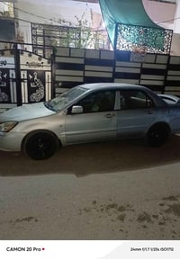 لانسر 2007 رقم انكليزي بابل سنويه ٢٩ باسمي مكاني بغداد.. اوتماتيك... م...