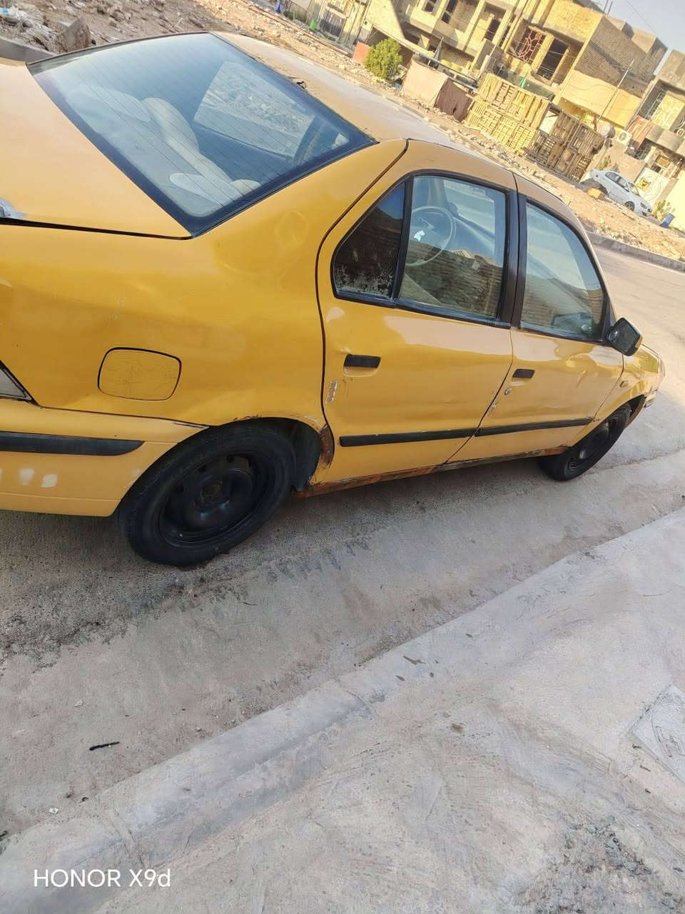 سياره سمند للبيع سعر14ورقه مداور مكاني كوت سياره خير من الله مكينه كير حداديه خياس معمر 
رقم راعيه ني مكلف. ***********

نص مكتوب في الصور:
- HONOR X9d