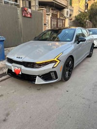 K5   GT 2025 للبيع  وارد أمريكي لون سمنتي  حادثها بنيد وچاملغ ودعامية ...