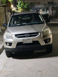 كيا سبورتاج  موديل  ٢٠٠٩ كوري لون ذهبي  (شمباني)محرك ٢٠٠٠ اربعه سلندر ...