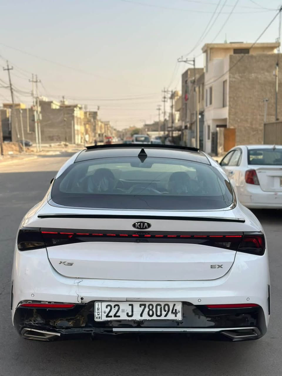 السلام عليكم حبايب 🩶
🚘 للبيع كيا K5 EX موديل 2021 فول مواصفات، اللون ابيض ، وارد أمريكي، سيارة نظيفة جداً، جاهزه ومناقصها اي شي 

✨ المواصفات:

* محرك 1Turbo 1600 

* جير أوتوماتيك 8 سرعات.

* بانوراما طكتين 

* 4 أوضاع قيادة: Smart - Custom - Sport - Normal

* قيادة شبه ذاتية (Lane Following Assist).

* مثبت سرعة ذكي (Smart Cruise Control).

* تحذير الخروج عن المسار مع تصحيح المسار.

* بريك طوارئ تلقائي (Automatic Emergency Braking).

* نظام الثبات الإلكتروني (ESC).

* نظام مانع الانزلاق (Traction Control).

* مراقبة النقطة العمياء (Blind Spot Monitoring)

* كاميرا خلفية مع حساسات أمامية وخلفية.

* شاشة كبيرة تدعم Apple CarPlay وAndroid Auto.

* نظام صوت BOSE الأصلي.

* تشغيل بصمة وبصمة أبواب (Smart Key).

* تشغيل عن بعد.

* مرايا شفط وقلاب كهربائية.

* فتحة سقف بانوراما.

* مقاعد جلد باللون الاسود 

* مقاعد أمامية كهربائية.

* تبريد وتدفئة للمقاعد الأمامية.

* تدفئة المقود.

* ميموري (Memory Seat) لمقعد السائق.

* شاحن لاسلكي.

* مكيف أوتوماتيك دبل زون.

* إنارة LED أمامية وخلفية.

* حساسات إنارة أوتوماتيكية.

* Auto Hold.

* فرامل يد إلكترونية (EPB).

* الدشبول صاجي 

📌 العداد: 75  ألف Mile.

📌 الحادث: كما موضح بالصور 

📌 السيارة بدون إيرباك، بدون لغود، بدون شواصي، وبجم كبس 

📌 رقم أربيل حره بأسمي تحويل ثاني يوم مكاني بغداد غزاليه اي استفسار *********** السعر 143
