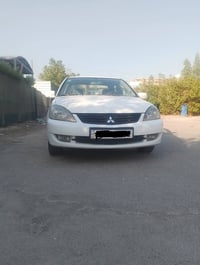 لانسر ٢٠١١ • رقم بغداد • صبغ مكفول