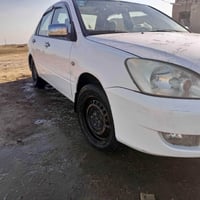 سياره مستبوشي لانسر موديل ٢٠١١ رقم بغداد خصوصي  رقم أنكليزي دولي سنويه...