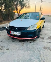 لانسر مديل 2010 ابسمي2027 خيط تبخير  بغداد الامين 07706218893