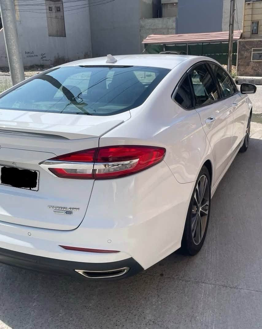 Ford Fusion Titanium 2019 للبيع

• الفئة: Titanium اعلى فئة
• المحرك: 2.0 EcoBoost تيربو 
• الممشى: 95,000 ميل
• المواصفات: Titanium فل أوبشن
* القوة: 245 حصان تقريبًا
* العزم: 275 lb-ft
* الجير: أوتوماتيك 6 سرعات 
* الجنوط: 19 إنچ
* المقاعد: جلد 
* المقاعد الأمامية: كهربائية، مع تسخين وتبريد ( مقعد السائق ذاكرة خزن)
* تحكم صوتي
* نقطة عمياء
* دركسون: مدفأ
* فتحة سقف
* شاشة SYNC 3 قياس 8 إنچ
* Apple CarPlay / Android Auto
* نظام صوت Sony
* كاميرا خلفية + حساسات
* تشغيل عن بُعد
* دخول وتشغيل بدون مفتاح
* مثبت سرعة
* أنظمة أمان ومساعدة للسائق 
* وهواي مواصفات بعد
- الضرر الجاملغ والبنيد مبدلات غير لون ومصبوغات بخ بأمريكا 
- السعر 125 ومجال بسيط
تواصل - ***********

نص مكتوب في الصور:
- BidFax.info