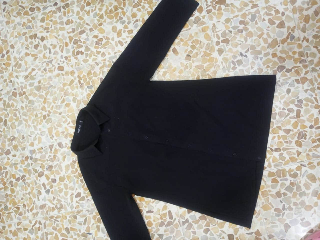 اي قطعة • ملابس