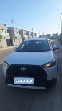 كورلا كروس مديل 2025   رقم بغداد  ماشيه 25 الف  مكفوله من الدعاميه للد...