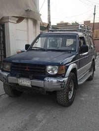 باجيرو 97 رقم بغداد السيارة باسمي  محرك 2400 مكفولة محرك وكير وفور ويل...