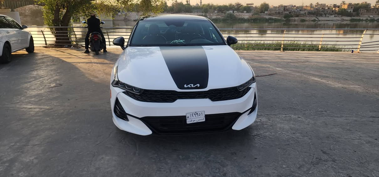 🚘 كيا K5     GT-Line 2023
السياره منفيس دخول جديد
اللون:  ابيض
الفئة: GT-Line فول مواصفات
المحرك: 1600 CC تيربو
الحادث: خلفي خفيف تبديل دعامية خلفيه 
الكشنات: احمر 

المواصفات:
بانوراما
بصمة تشغيل وتشغيل عن بعد
شحن هاتف لاسلكي
قيادة ذاتية على الخطوط السريعة
هاند بريك بصمة
مثبت سرعة
ABS ومانع انزلاق
حساس ضغط الإطارات
بك لايت LED
شاشة مع خرائط ملاحة
كاميره دوارة
رادارات جانبية ومراقبة النقطة العمياء
رادار الخطوط البيضاء
إشارات بالمرايا
لايتات 3 عدسات
أوضاع قيادة Eco / Sport / Smart / Normal
بلوتوث + USB + AUX
تحكم ستيرن كامل
كير أوتو + عادي
أوتو بريك
ستيرن LED D
زينون
توقف ذاتي عند الرجوع
صندوق بصمة

📍 المكان: بغداد الكاظمية
  ***********
***********
