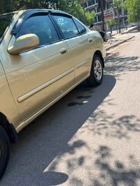 للبيع نيسان سنتره موديل 2000 كير اوتماتيك مكينه 2000 رقم بغداد  مصبوغه...