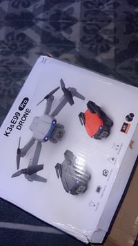 هذا درون K13 & E99 Pro 📸🚁، ومكتوب على العلبة يدعم 4K،، وإضاءة LED، وتص...