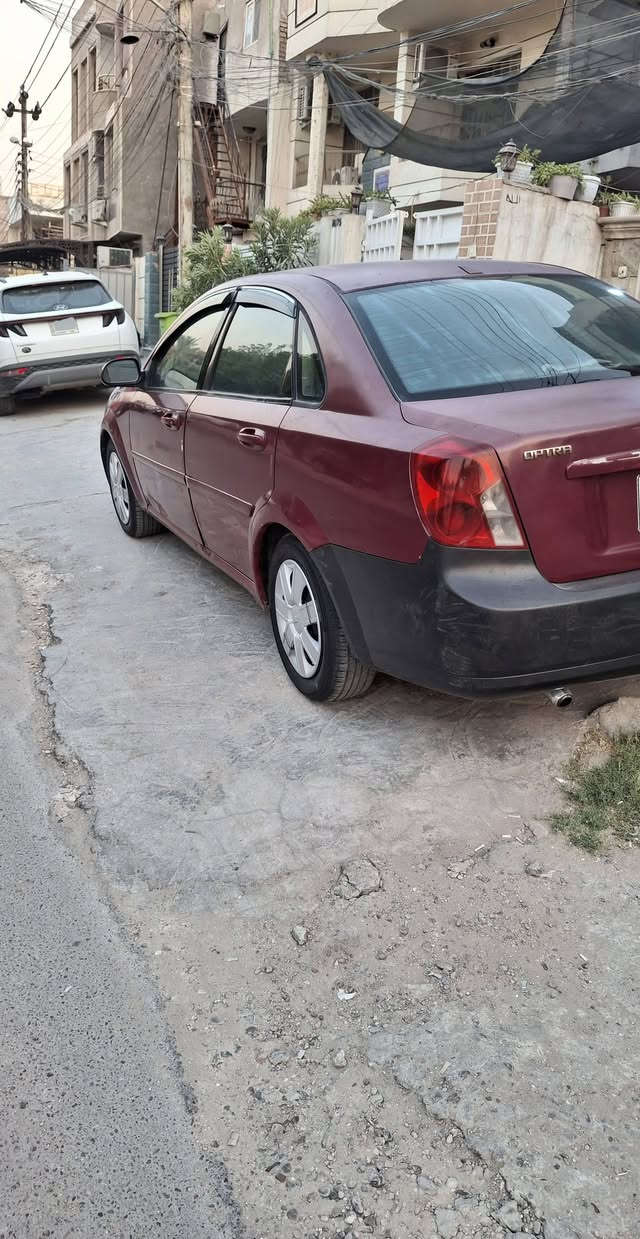 اوبترا موديل 2005 رقم بغداد دولي بأسمي
كير محرك نضيفات [ كير اوتوماتيك ]
تبريد شغال ... صدر نظيف ... تخم تاير جديد . 
... السياره بدون اي ضربه قويه والكشر واضح بالصور يحتاجلها صبغ التفيده السياره يتصل ... 
السعر 48 وبيها مجال بسيط .
مكان السياره بغداد العامريه .
للاستفسار اتصل عالرقم ( *********** )
