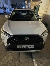 تويوتا كورلا كروس هايبرد 2025  ماشيه 20 الف جديدة جدًا  رقم بغداد بأسم...