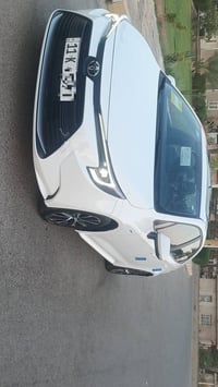 كورلا هايبرد موديل ٢٥ رقم بغداد مكفولة كفاله عامه باسمي ماشيه 5000 مكا...