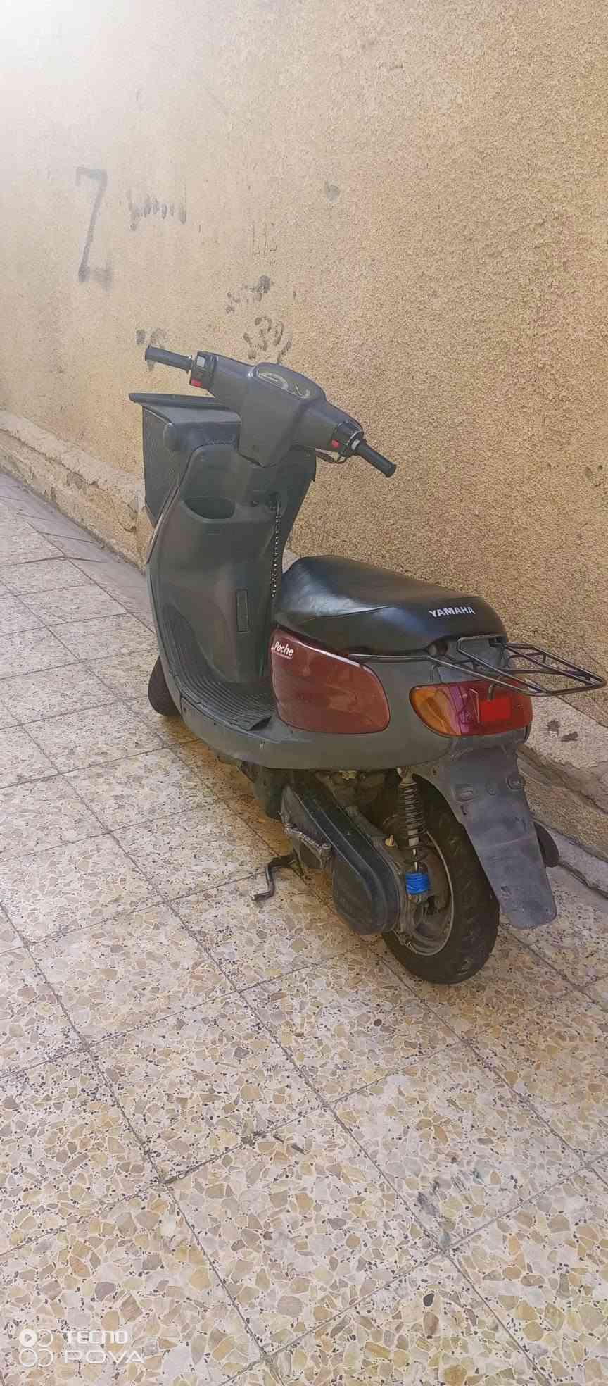 سلام عليكم للبيع دراجه منغولي درجه جديه  مكينه وكير شرط ما مفتوحه  سلف وهندر  كهربائيات كله شغاله كفرات كله بلادي درجه مال حاويه سعر ٥٠٠ بيه مجال لل شراي مكان دراجه  كربلاء رقم ***********

نص مكتوب في الصور:
- TECNO POVA